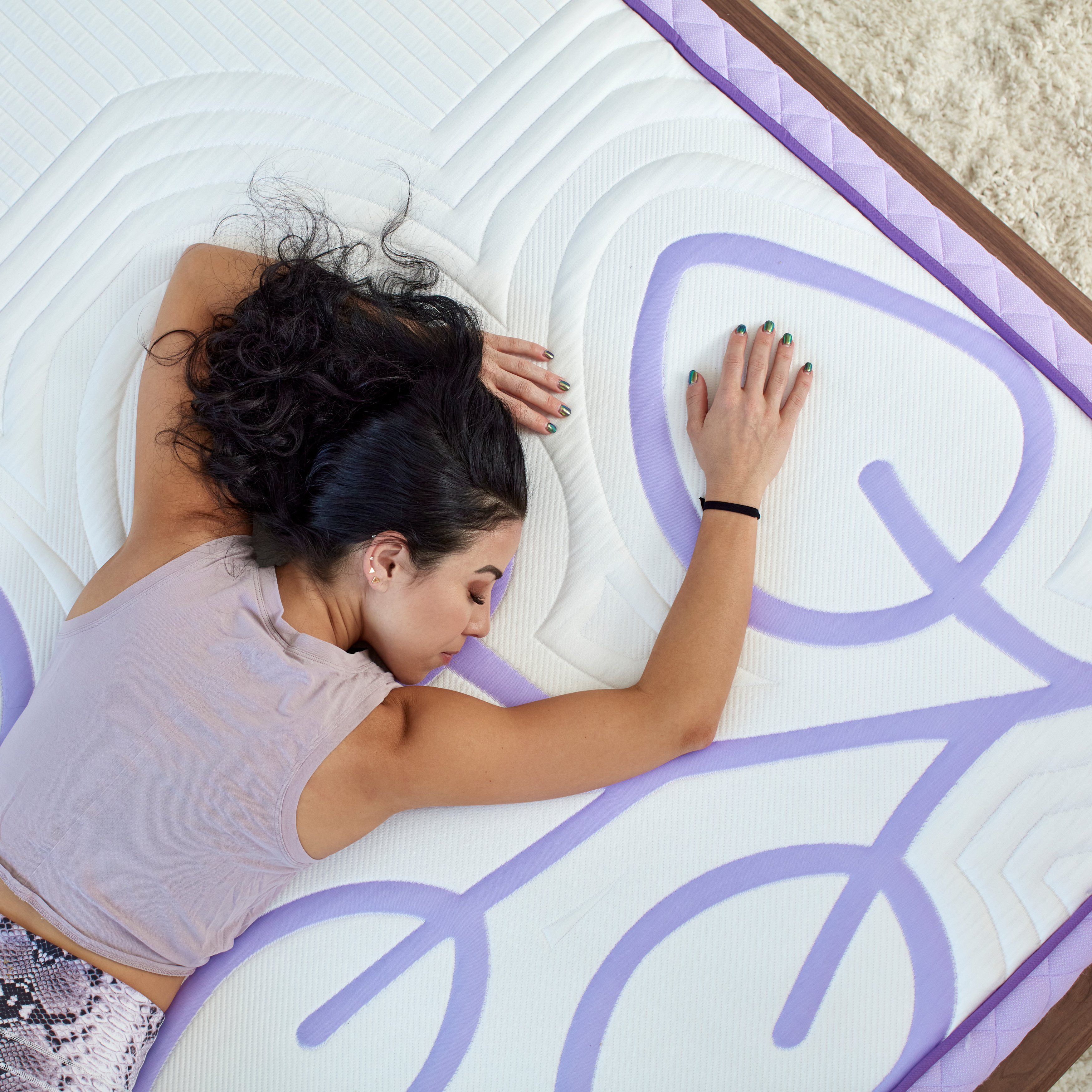 woman asleep on a natural hybrid mattress
