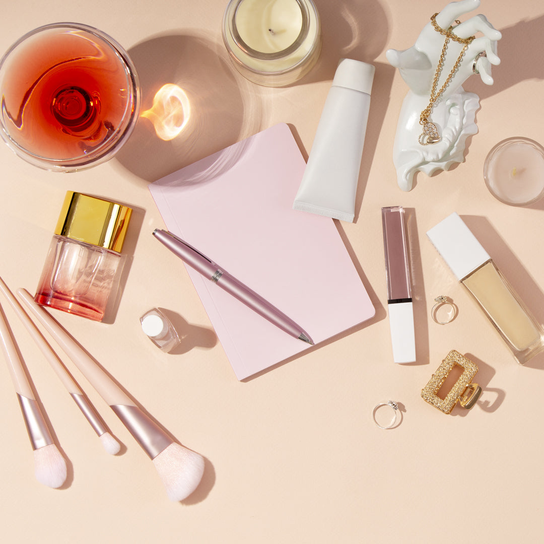 product photography beauty flat lay on a peach backdrop